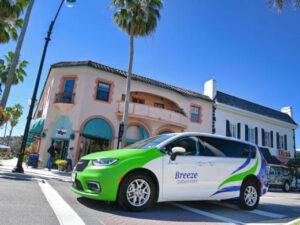 A minivan with Breeze OnDemand branding.