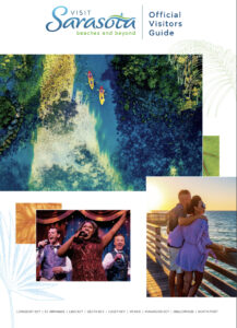 "Visit Sarasota: beaches and beyond | Official Visitors Guide" brochure cover featuring an overhead shot of some kayakers, a photo of a couple standing on a pier enjoying the ocean and three jubilant performers onstage.
