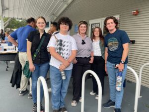 A group of young people poses together.