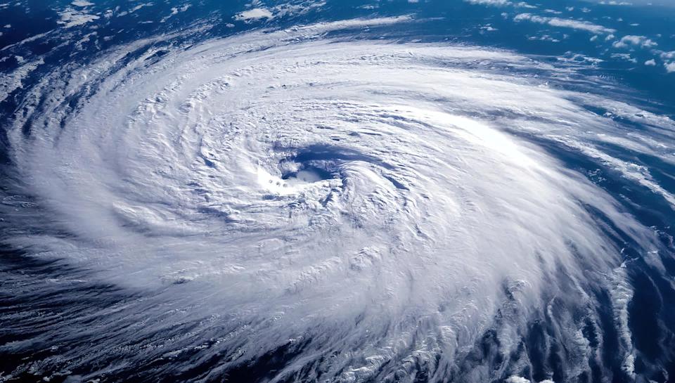 A hurricane viewed from distantly overhead.