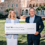 Richard Corcoran and Sydney Gruters holding a giant check made out to the New College Foundation in the amount of $2.5 million.