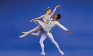 Two costumed ballet dancers posing.