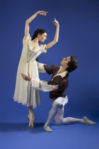 Two costumed ballet dancers posing.