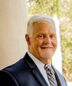 Ron McDonough smiling.