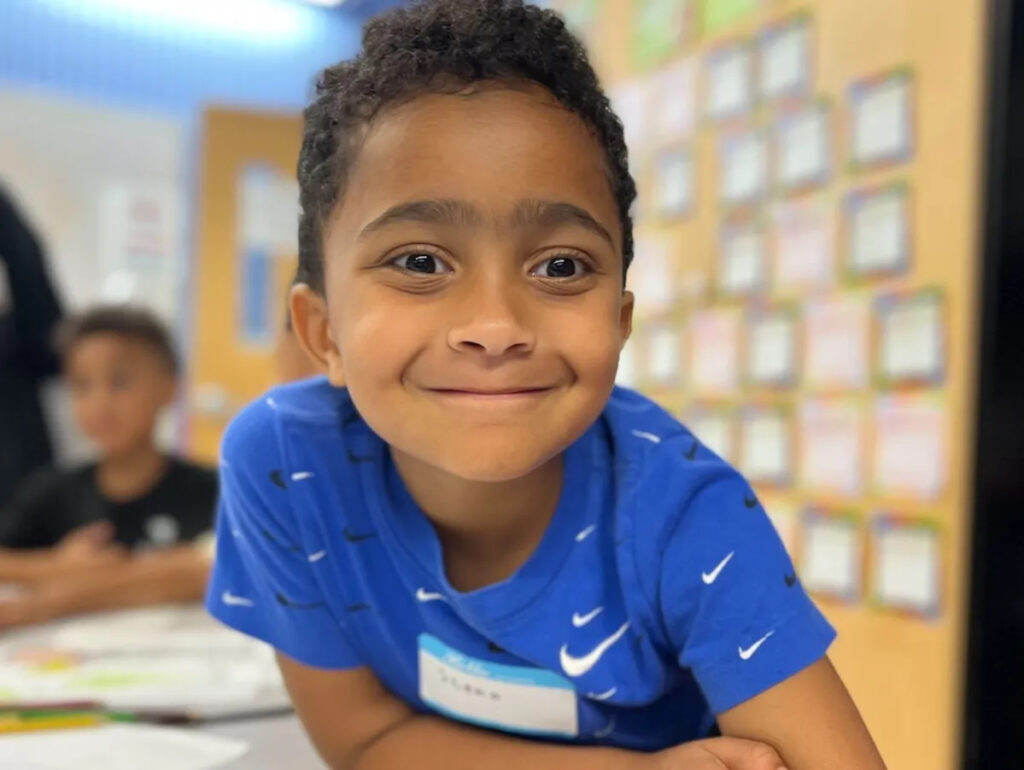 Photo of a young child smiling.