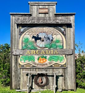 Wooden sign that reads, "Historic Arcadia welcomes you."