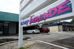 Whimsical signage that reads "Betseys Arcade."