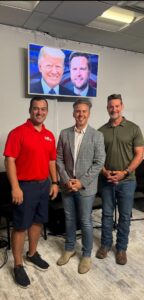 Brian Gibbs, Greg Steube and Neil Rainford standing together and smiling.