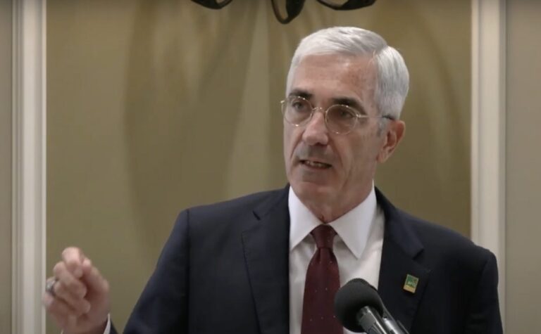 Rick Piccolo gesturing while speaking.