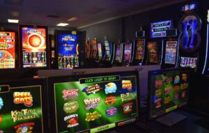 Interior at an arcade packed with wall-to-wall slot machined.