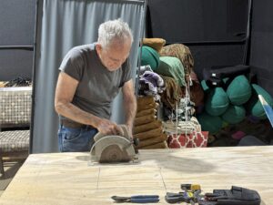 A person working at a workbench.