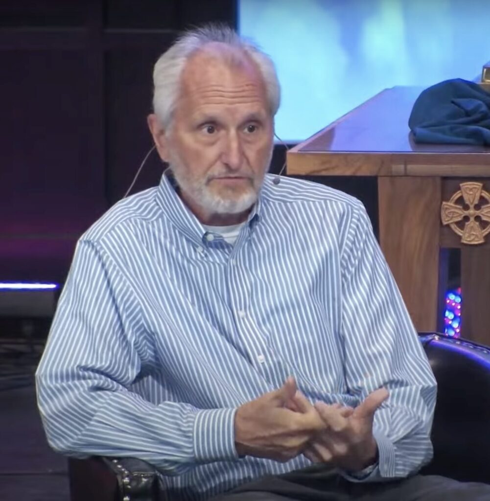 Rob Lorei gesticulating while speaking.