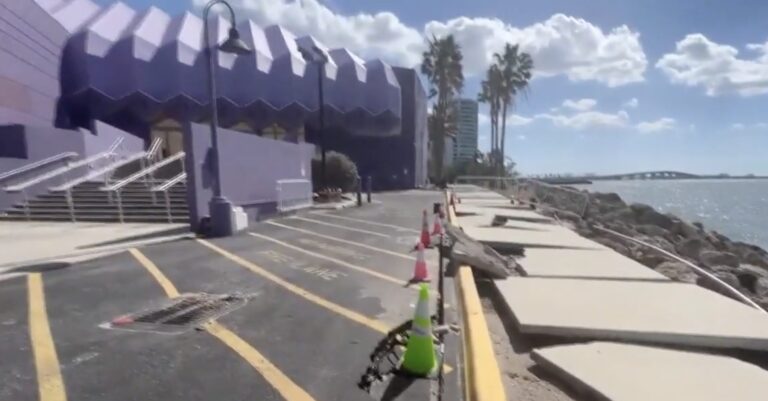 Photo taken of the bay side of the Van Wezel showing heavy damage to the sidewalk and road.