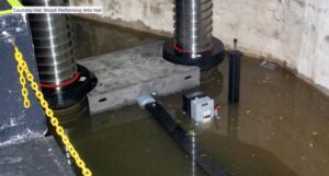 A transformer mostly submerged by floodwater. A cutline in the corner reads "Courtesy: Van Wezel Performing Arts Hall".
