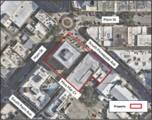 Annotated aerial photo highlighting a property at the corner of Main St and South Pineapple Ave.