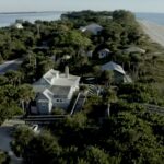 Aerial photo of a cluster of buildings along the coast.