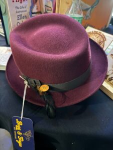 A purple fedora on display.