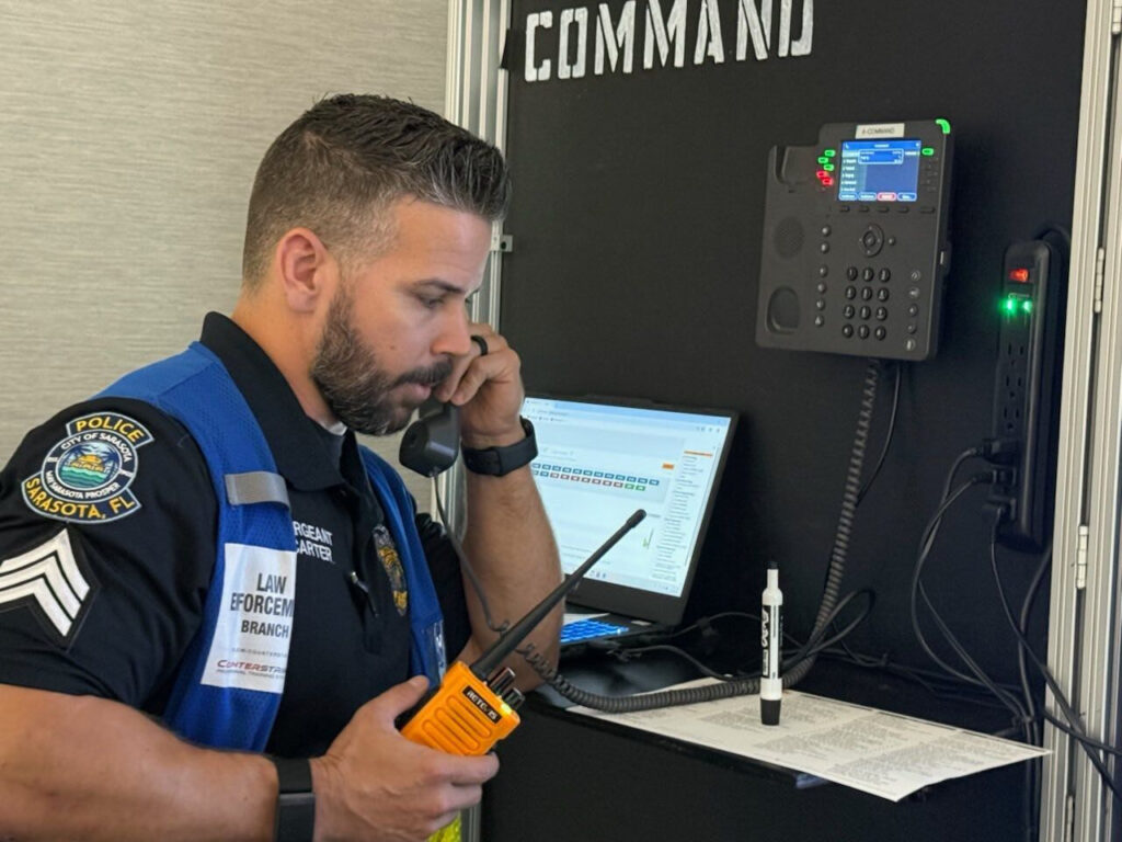 A police officer speaks on the telephone.