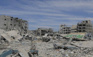 Photo of several buildings reduced to rubble.