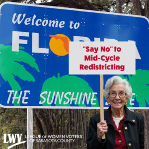 A demonstrator stands in front of a "Welcome to Florida" road sign with a picket sign that reads "'Say No' to Mid-Cycle Redistricting". A watermark in the bottom-right reads "LWV: League of Women Voters of Sarasota County".