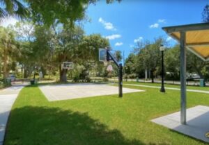 Photo of a basketball court in a park.