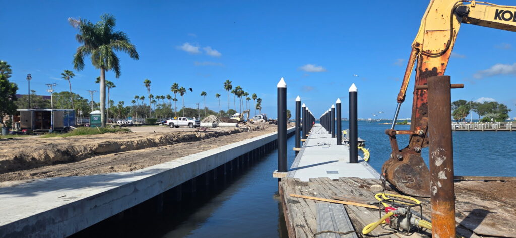 A boat canal adjacent to a construction site.