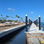 A boat canal adjacent to a construction site.