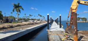 A boat canal adjacent to a construction site.