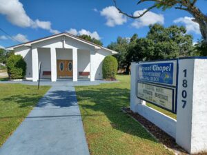 A tiny church with a sign outside reading "Bryant Chapel Christian Methodist Episcopal Church" and "A greatful heart attracts blessings".
