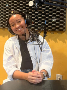 Annie Dong in a studio smiling.
