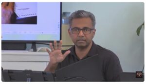 Raj Doraisamy gesticulating while speaking.