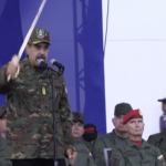 Maduro holds Bolívar's sword and addresses a crowd.