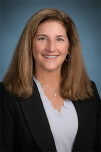 Beth Levine smiling.