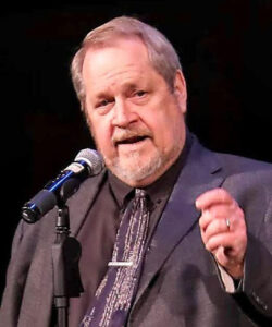 Murray Chase speaking into a microphone.