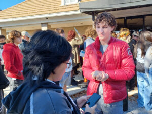 Zander Moricz among a crowd of protesters.