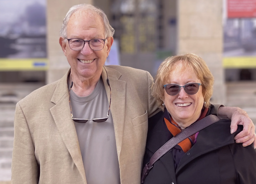 Anthony Stone with his arm around Katherine Van Wezel. Both are smiling.