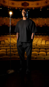 LaMichael Leonard Jr. standing on a stage.