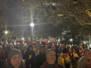 A crowd gathered in downtown Sarasota for a candlelit vigil.