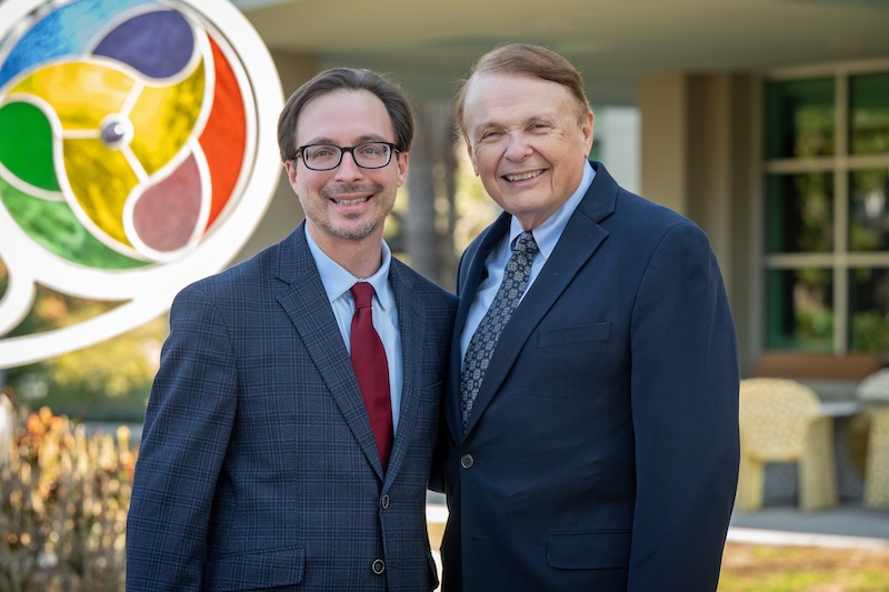 David Schneiderman and Larry Thompson smiling.