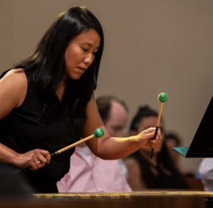 Tihda Vongoth playing a marimba.