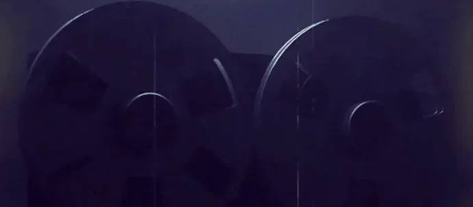 Animated dimly lit reel-to-reel tape machine