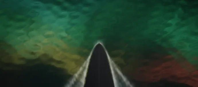 Animated overhead view of a ship bow cutting through water that reflects a green, gold and red aurora
