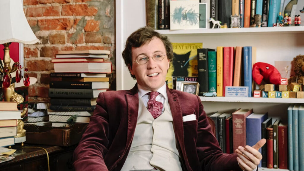 Nathan J. Robinson gesticulating while speaking.