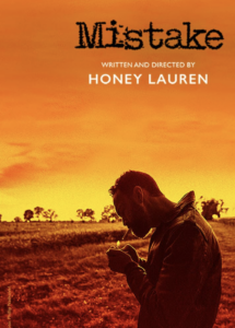 Poster for a film titled "Mistake" featuring a person lighting a cigarette in a field.