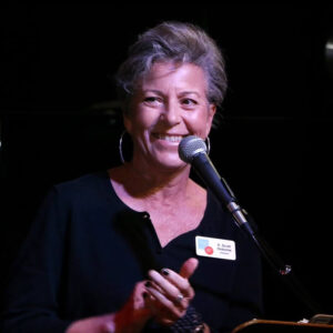 E. Scott Osborne speaking into a microphone.