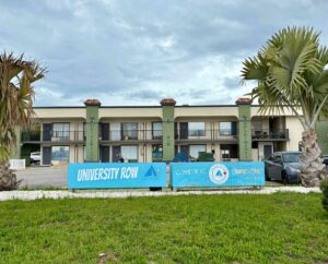 A banner outside a renovated motel that read "University Row".