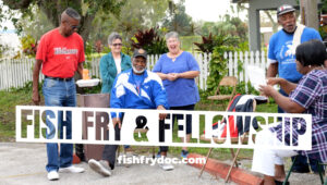 A group of smiling people outdoors. A logo reads "Fish Fry & Fellowship". Beneath, text reads "fishfrydoc.com".