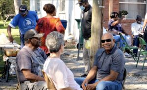 A crowd at an outdoor fish fry.