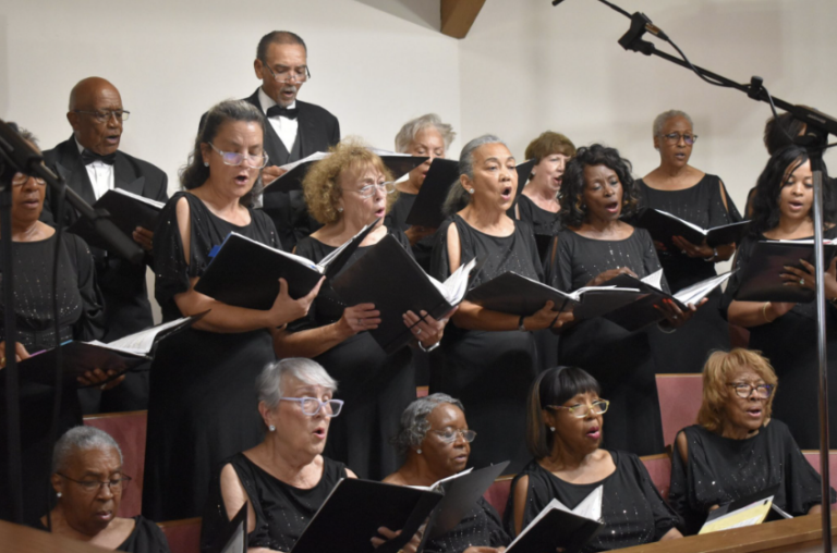 Members of the Gulf Coast Community Choir singing.