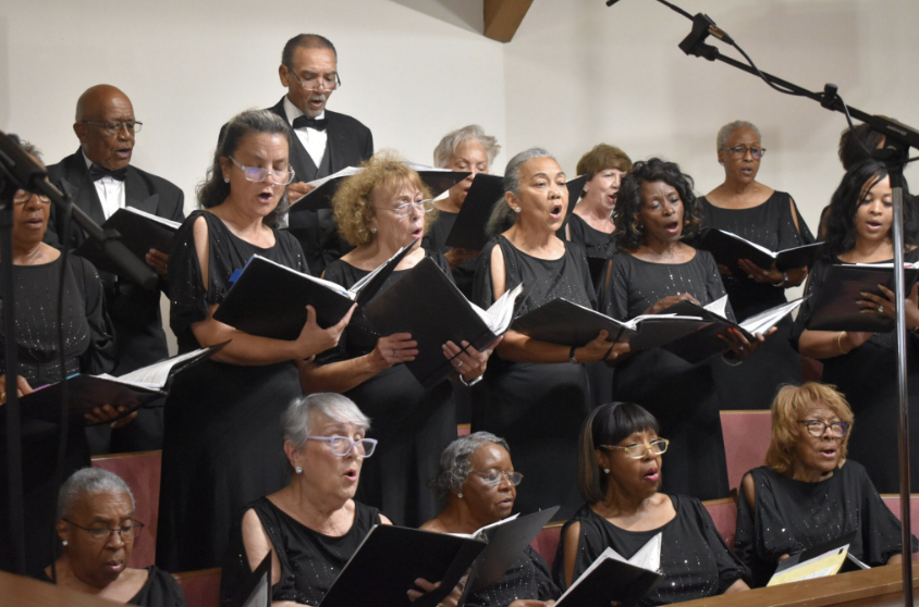 Members of the Gulf Coast Community Choir singing.